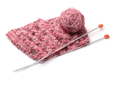Knitting with needles and yarn ball isolated on white